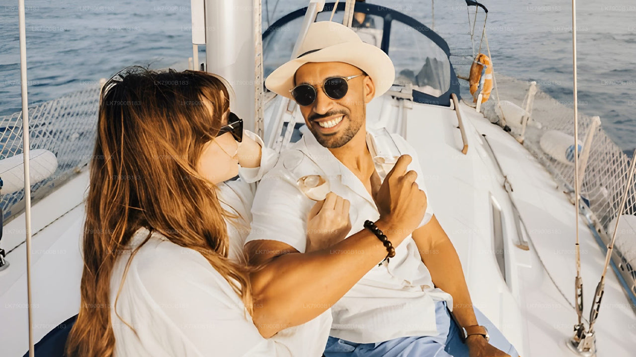 Man and woman on a sailboat, enjoying a sunny day at sea.
